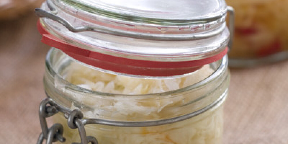 Marinated cabbage (sauerkraut) in glass jar, selective focus