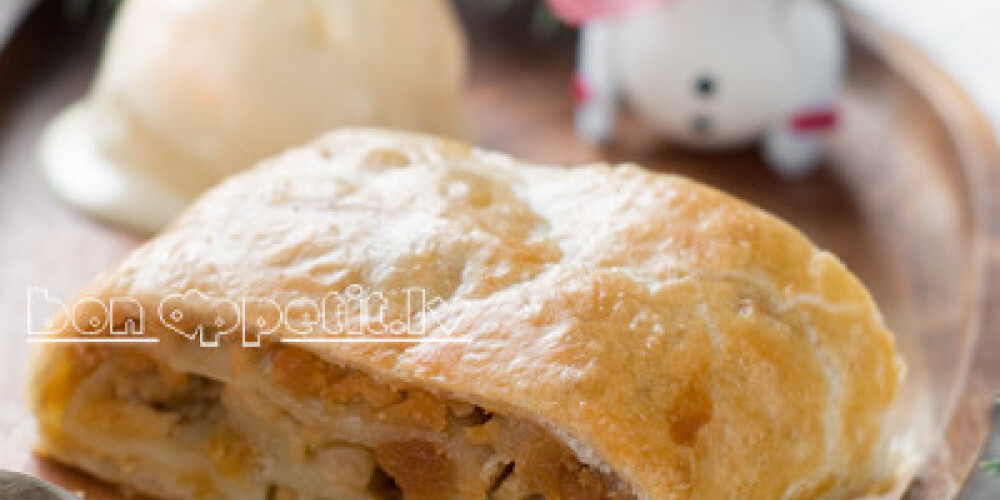 slice of an apple strudel with ice cream, selective focus