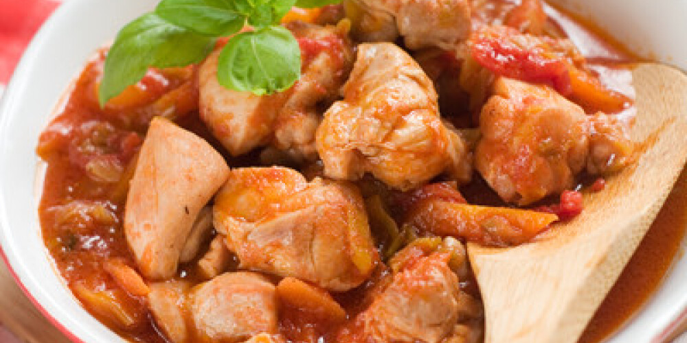 Provencal chicken stew with pepper ant tomato, selective focus