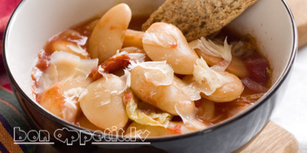 A bowl of homemade chili bean soup with cheese, selective focus