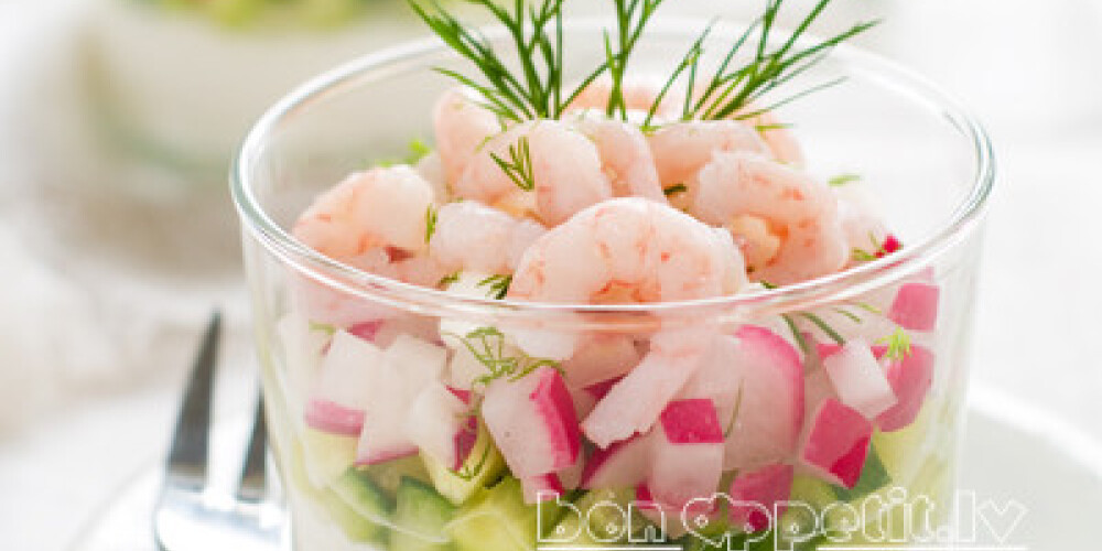 Salad with cottage cheese, radish, cucumber and shrimps, selective focus