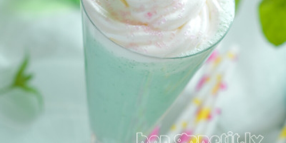 Mint milkshake with whipped cream, selective focus