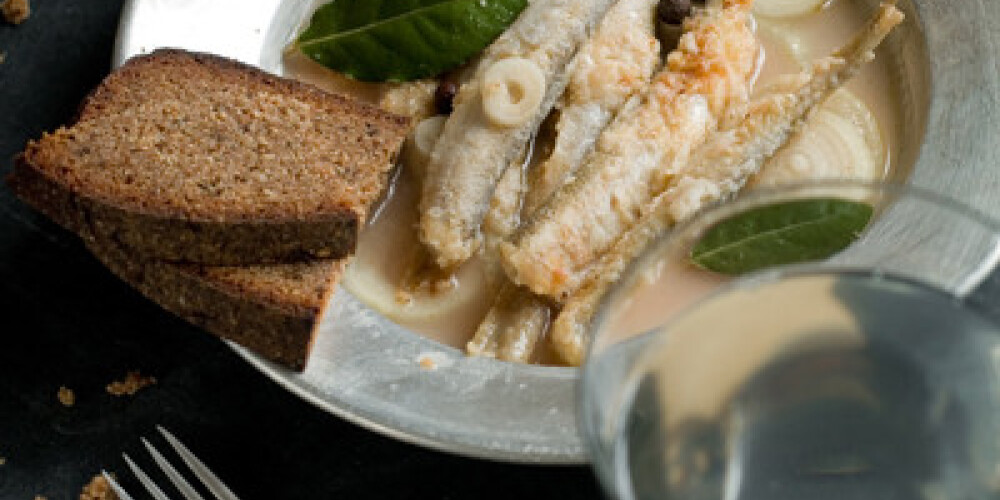 Marinated fried sardines with onion, selective focus