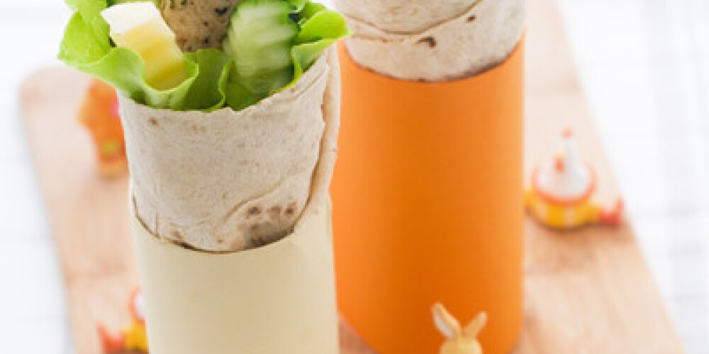 Wrap with grilled chicken and vegetables for children party, selective focus