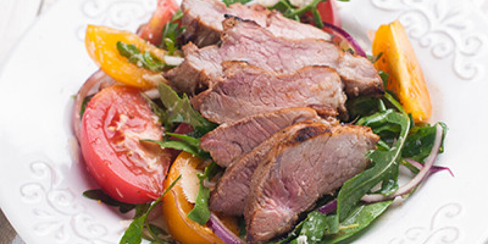 Salad with steak and fresh vegetables, selective focus