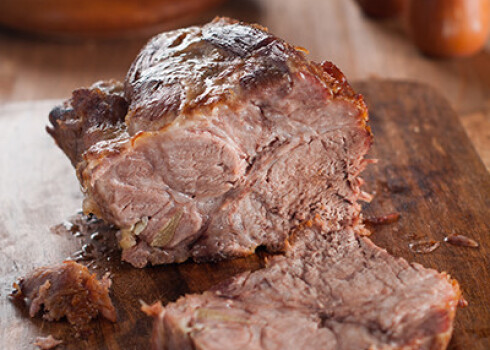 Roasted meat with apple, selective focus