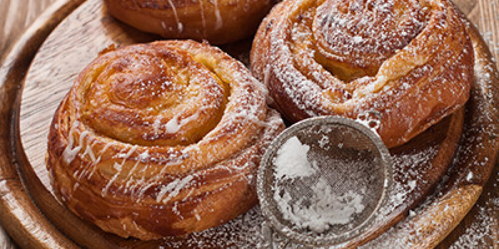 Sweet bun with cinnamon and sugar, selective focus