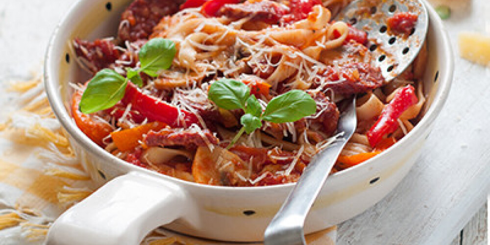 Pasta with tomato sauce and pepper, selective focus