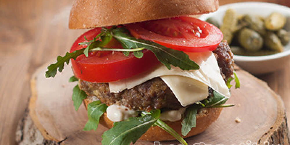 Homemade hamburger with fresh tomatoes, selective focus