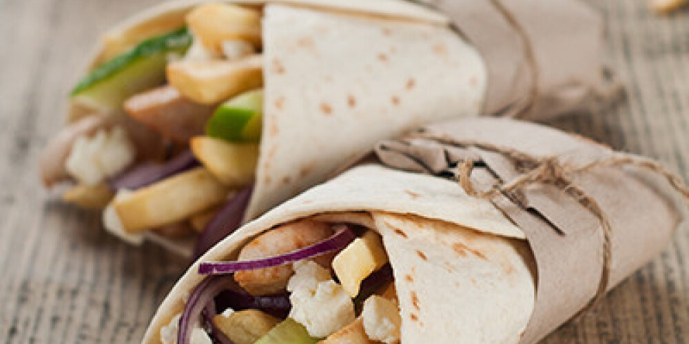 Fresh tortilla wraps with grilled chicken,vegetables and potato, selective focus