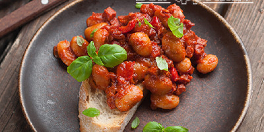 Bean salad with tomato sauce on bread, selective focus