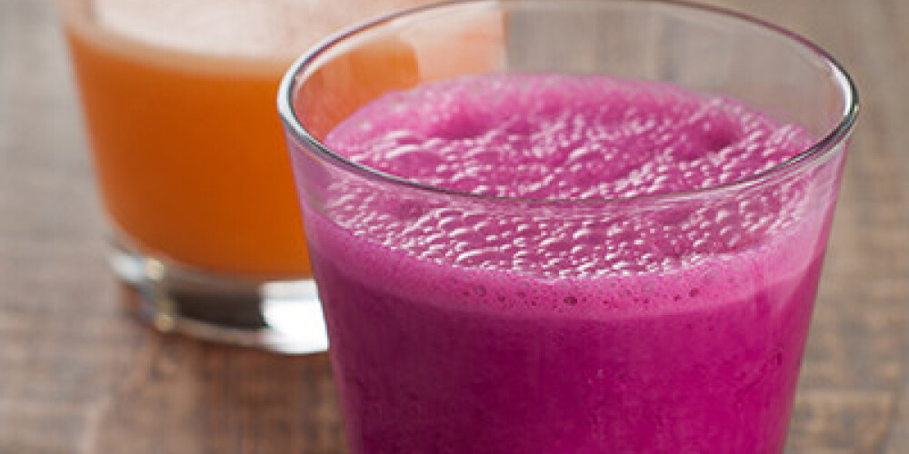 Drink smoothies on wooden table, selective focus