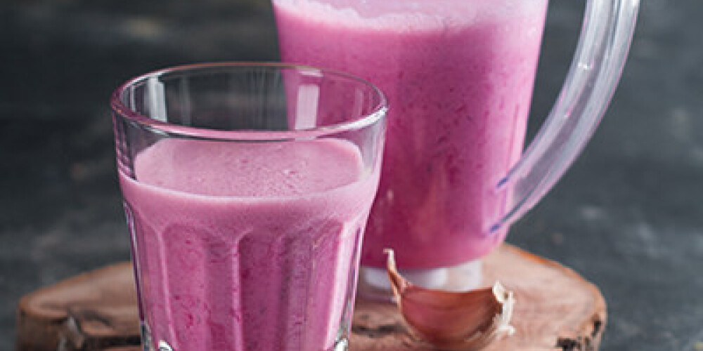 Fresh vegetable smoothie served in glass and jug, selective focus