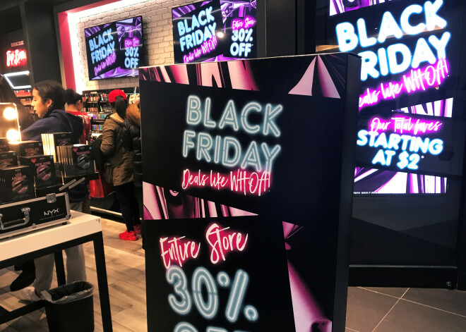 FILE PHOTO: A Black Friday sale sign is displayed outside a makeup store at Roosevelt Field shopping mall in Garden City, New York, U.S., November 24, 2017. REUTERS/Shannon Stapleton/File Photo