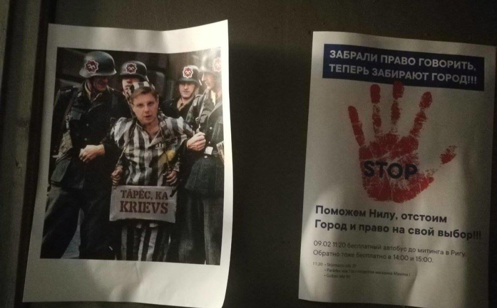Bezmaksas autobuss uz piketu un lūgumi palīdzēt Nilam - Rīgas māju kāpņu telpās izvietoti naidu kurinoši Ušakova atbalsta plakāti