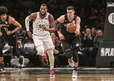 Apr 18, 2019; Brooklyn, NY, USA;  Brooklyn Nets forward Rodions Kurucs (00) brings the ball up court against Philadelphia 76ers forward Greg Monroe (55)  in the third quarter in game three of the first round of the 2019 NBA Playoffs at Barclays Center. Mandatory Credit: Wendell Cruz-USA TODAY Sports