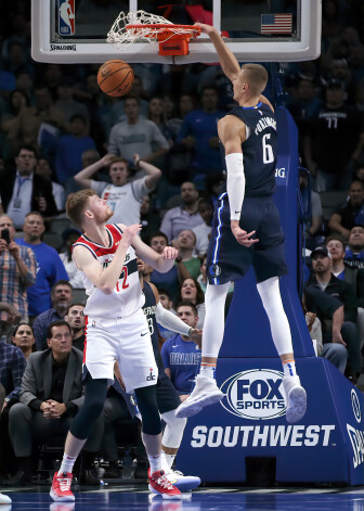 Oct 23, 2019; Dallas, TX, USA; Dallas Mavericks forward Kristaps Porzingis (6) dunks over Washington Wizards forward Davis Bertans (42) during the fourth quarter at American Airlines Center. Mandatory Credit: Kevin Jairaj-USA TODAY Sports