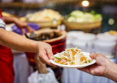 hand to hand somtum (spicy Thai papaya salad) famouse local traditional unique salad in the world.