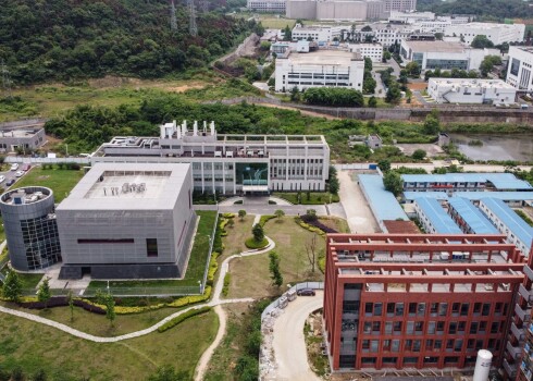 This aerial view shows the P4 laboratory (L) on the campus of the Wuhan Institute of Virology in Wuhan in China's central Hubei province on May 13, 2020. - Opened in 2018, the P4 lab, which is part of the greater Wuhan Institute of Virology and conducts research on the world's most dangerous diseases, has been accused by top US officials of being the source of the COVID-19 coronavirus pandemic. (Photo by Hector RETAMAL / AFP)