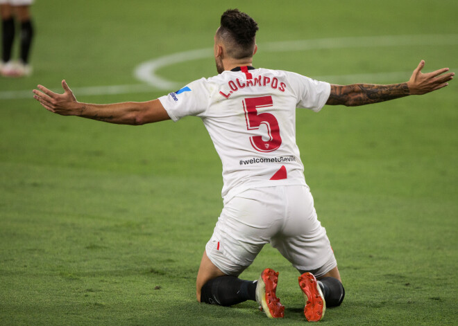 Okamposs gūst vārtus un vārtsarga lomā nosargā "Sevilla" uzvaru; Anglijā Lorī saplūcas ar Sonu