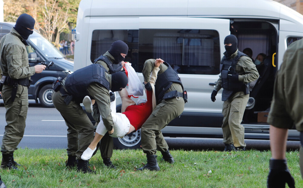 During the women’s demonstration, security forces detained about 100 people in Minsk