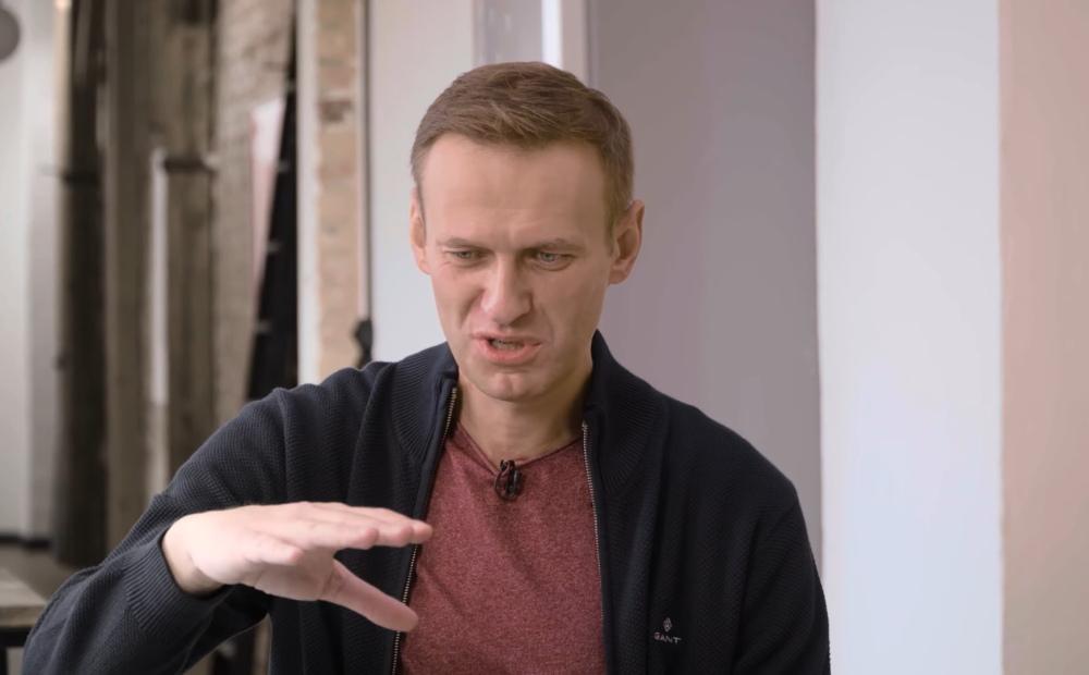 In a video interview, Navalny shows his still trembling hands and says that he feels like a guinea pig