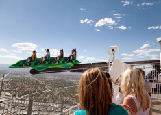 people enjoying the X-scream ride at the top of the Stratosphere hotel, Las Vegas