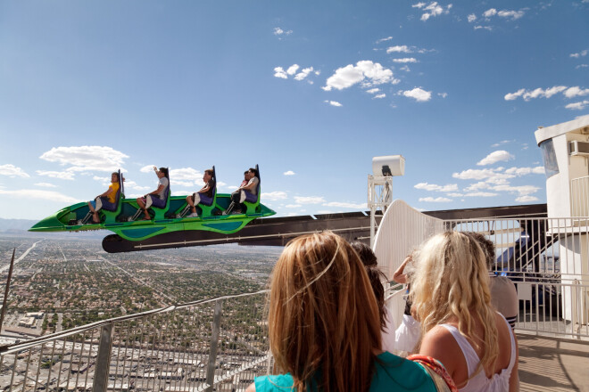 people enjoying the X-scream ride at the top of the Stratosphere hotel, Las Vegas