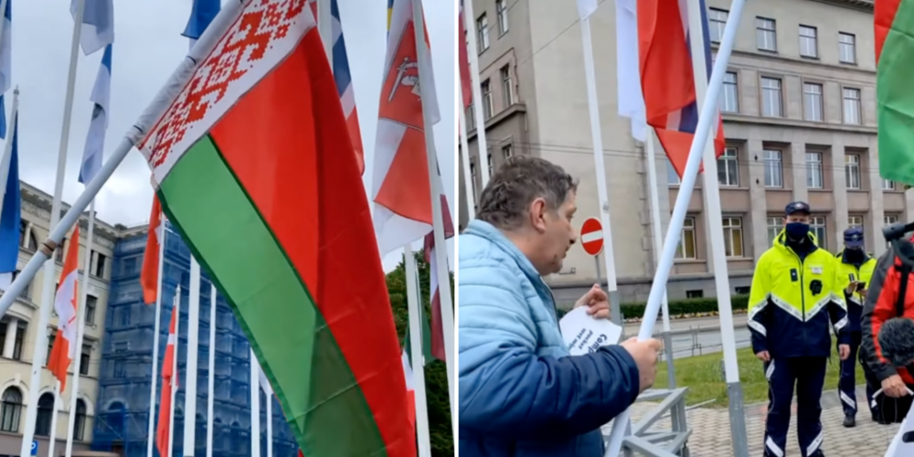 ВИДЕО: в центре Риги мужчина хотел вывесить флаг Беларуси, полиция не разрешила