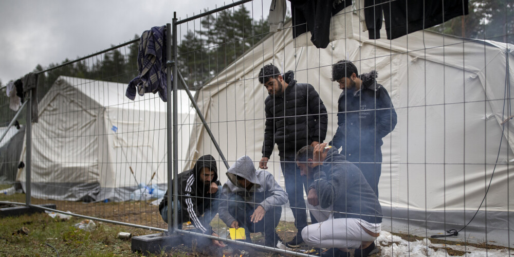 Migranti uz Lietuvas robežas.