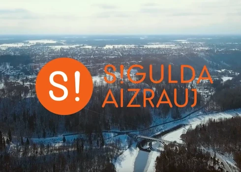 Attēlā ir redzams "Sigulda aizrauj" logo, taču būtu piedodams, ja vērotājs to sajauktu ar partijas "Stabilitātei!" logo, kurš attēlots ļoti līdzīgā veidā.