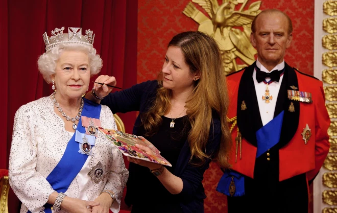 Finishing touches to Queen Elizabeth II and Prince Philip waxworks