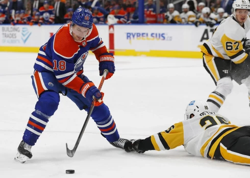 Oct 24, 2022; Edmonton, Alberta, CAN; Edmonton Oilers forward Zach Hyman (18) tries to get a shot away over top of Pittsburgh Penguins forward Ryan Poehling (25) during the third period at Rogers Place. Mandatory Credit: Perry Nelson-USA TODAY Sports