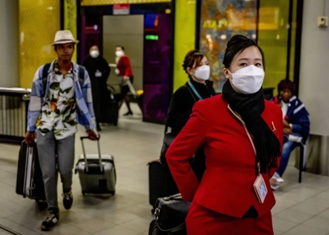 Китай на фоне вспышки Covid-19 отменил карантин для приезжих из-за границы
