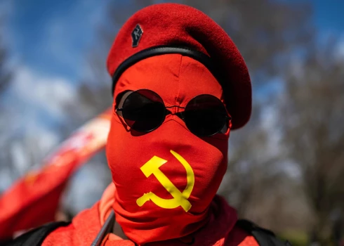 An activist poses for a photo during an antiwar rally to mark the one-year anniversary of the war in Ukraine, at the Lincoln Memorial in Washington, DC, on February 19, 2023. - Demonstrators are calling to cut any type of funding for the war in Ukraine. (Photo by ANDREW CABALLERO-REYNOLDS / AFP)