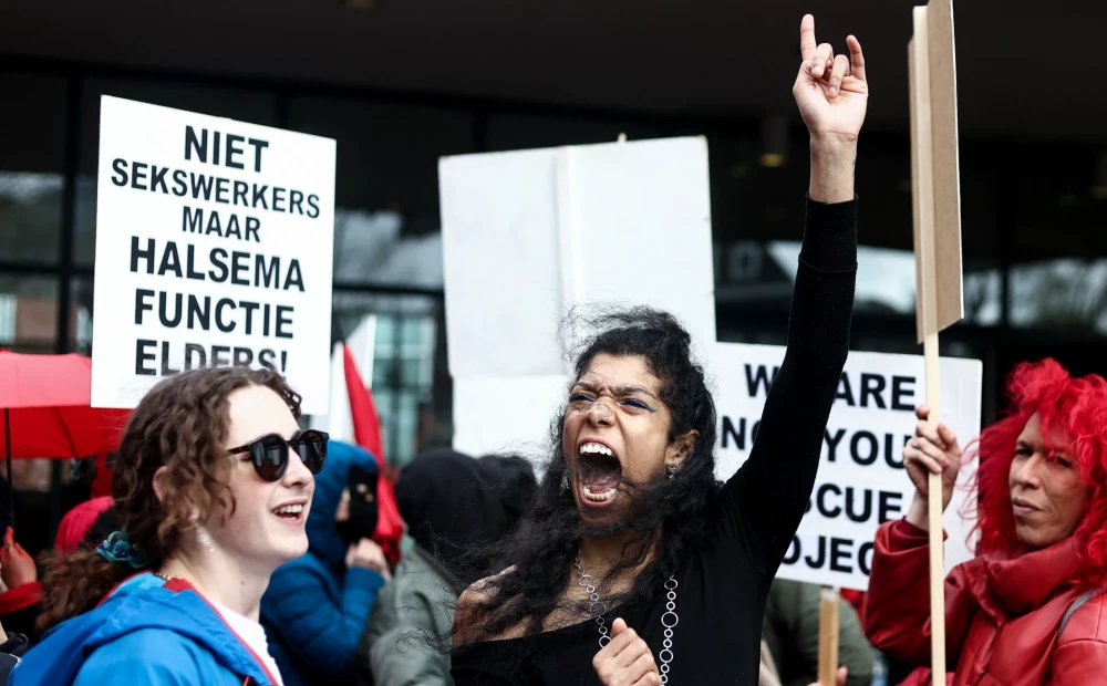 The “moths” of Amsterdam demonstrate against the controversial strategy to deter British tourists.