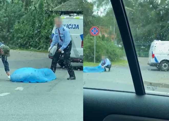 На улице на Саркандаугаве внезапно умер мужчина, полиция его накрыла полиэтиленом. То, что произошло дальше, вызывает недоумение