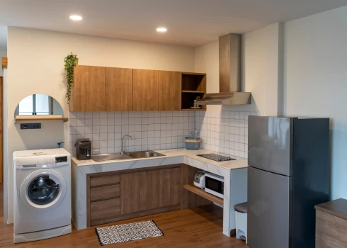 Kādas problēmas daudzstāvu mājas kaimiņiem var radīt virtuvē uzstādīta veļasmašīna?