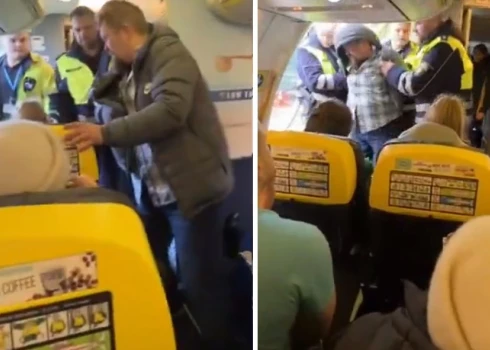 ВИДЕО: неадекватного пассажира пришлось силой выводить с самолета Рига-Дублин