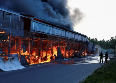 Firefighters work at a site of a household item shopping mall hit by a Russian air strike, amid Russia's attack on Ukraine, in Kharkiv, Ukraine May 25, 2024. REUTERS/Valentyn Ogirenko