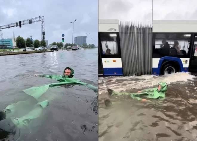 ВИДЕО: блогер в зеленом плаще поплавал в огромной луже рядом с машинами в Риге