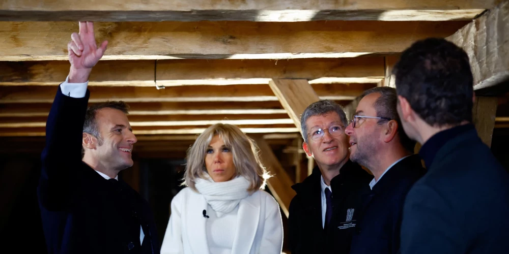 epa11747341 French President Emmanuel Macron (L), his wife Brigitte Macron, Philippe Jost, in charge of the conservation and restoration of Notre-Dame de Paris cathedral, and Remi Fromont, chief architect of Monuments History in charge of restoration, meet carpenter Jean-Louis Bidet during a visit of Notre-Dame de Paris cathedral in Paris, France, 29 November 2024. French President Macron is visiting the cathedral's construction site on 29 November, to thank the donors and people who worked to rebuild the monument after it was severely damaged in a fire that broke out on 15 April 2019. The Paris Cathedral will be officially inaugurated after nearly six years of renovation work on 07 December 2024.  EPA/SARAH MEYSSONNIER / POOL MAXPPP OUT