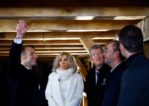 epa11747341 French President Emmanuel Macron (L), his wife Brigitte Macron, Philippe Jost, in charge of the conservation and restoration of Notre-Dame de Paris cathedral, and Remi Fromont, chief architect of Monuments History in charge of restoration, meet carpenter Jean-Louis Bidet during a visit of Notre-Dame de Paris cathedral in Paris, France, 29 November 2024. French President Macron is visiting the cathedral's construction site on 29 November, to thank the donors and people who worked to rebuild the monument after it was severely damaged in a fire that broke out on 15 April 2019. The Paris Cathedral will be officially inaugurated after nearly six years of renovation work on 07 December 2024.  EPA/SARAH MEYSSONNIER / POOL MAXPPP OUT