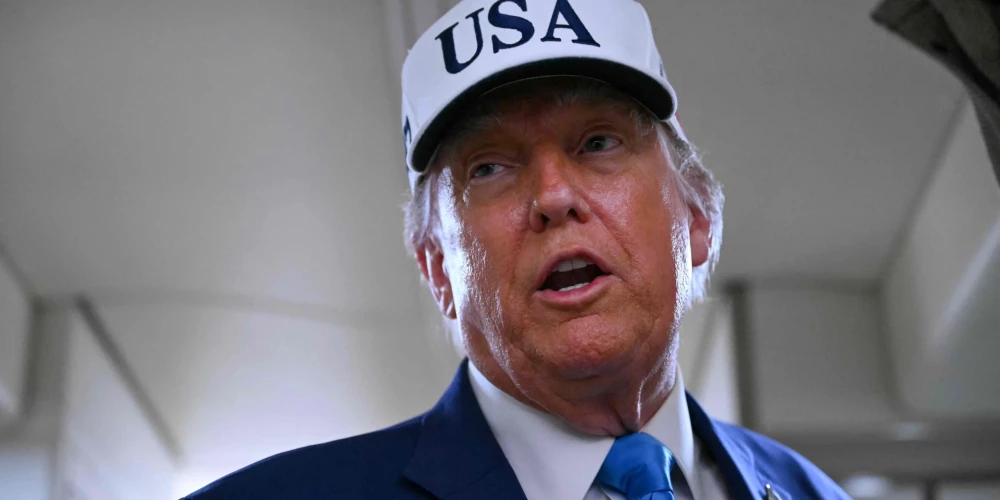 US President Donald Trump talks to the press aboard Air Force One on the way to Morristown Municipal Airport in Morristown, New Jersey, on June 6, 2025. Trump is travelling to his residence and golf club in Bedminster, New Jersey. (Photo by ANDREW CABALLERO-REYNOLDS / AFP)