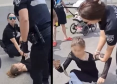 VIDEO: Rīgā garāmgājēji aizstāv jaunieti, kuru pašvaldības policisti tur uz asfalta