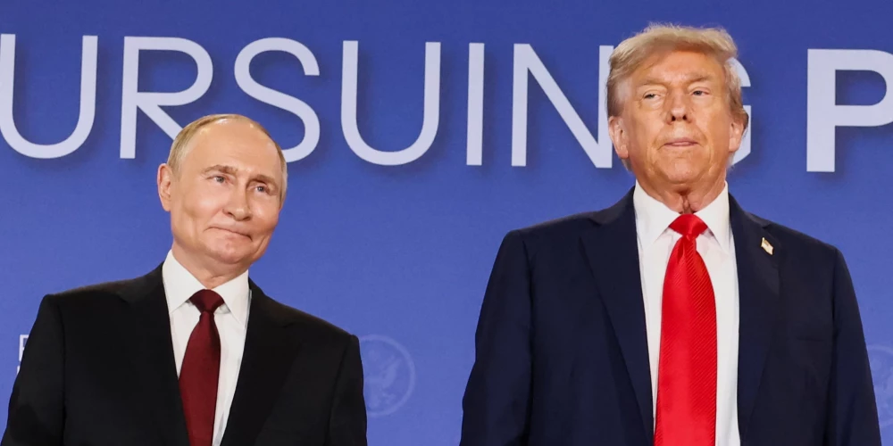 U.S. President Donald Trump and Russian President Vladimir Putin stand next to each other during a press conference following their meeting to negotiate an end to the war in Ukraine, at Joint Base Elmendorf-Richardson, in Anchorage, Alaska, U.S., August 15, 2025. REUTERS/Kevin Lamarque