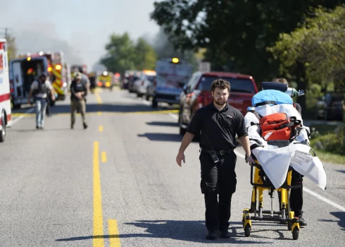 Emergency responders work the scene outside The Church of Jesus Christ of Latter-day Saints following a shooting and fire in Grand Blanc, Mich., Sunday, Sept. 28, 2025. (Lukas Katilius/The Flint Journal via AP)