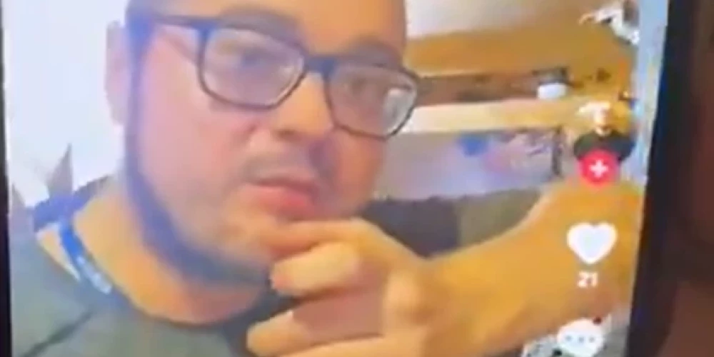 Vīrietis, kurš draud nošaut Aināru Šleseru (ekrānuzņēmums no video)