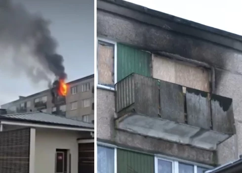 Женщину спасли с балкона во время пожара в многоэтажке.