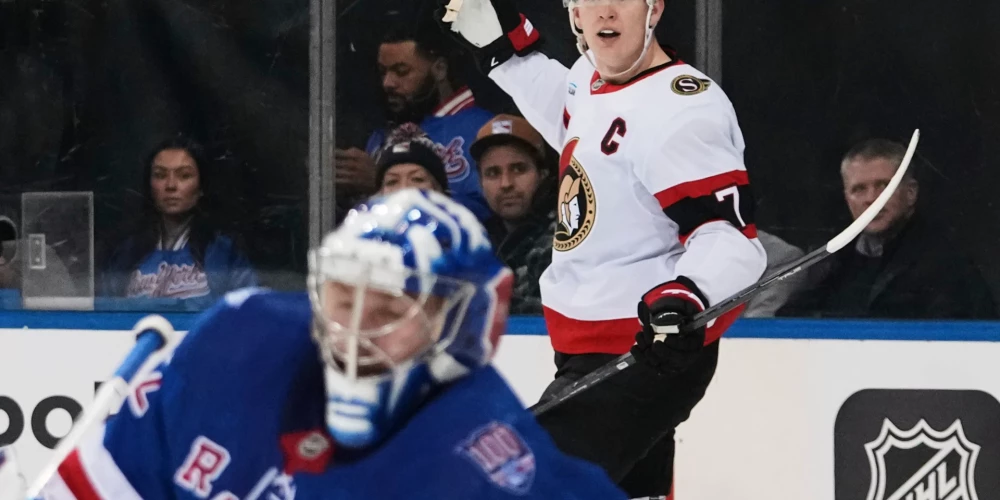 Breidijs Tkačaks priecājas par Džonatana Kvika pārspēšanu.